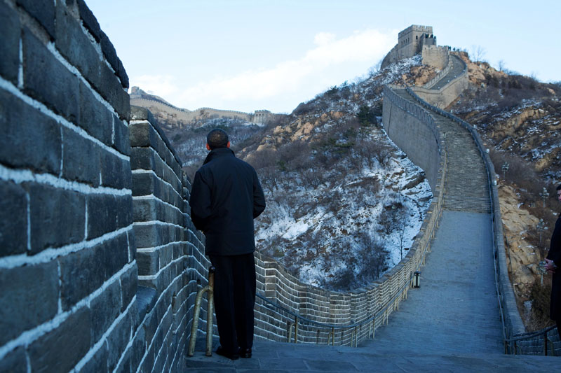 Former United States President Barack Obama stands on the Great Wall of China during a visit in 2009.