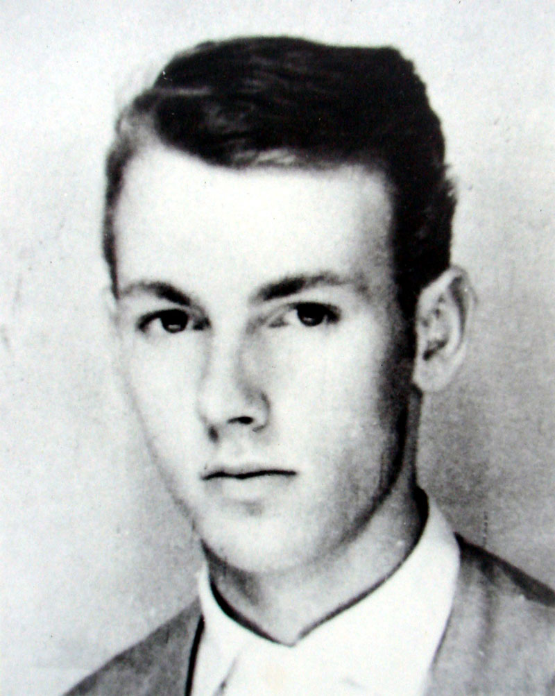 A black and white photo of a young German man.